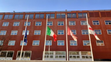 Flags before Civitas building (U7) at Bicocca University